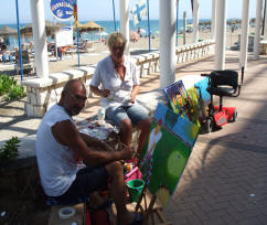 Piet en Carola schilderen op de Boulevard